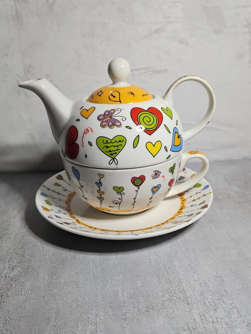 G. Wurm Tea for One porcelain set featuring a vibrant heart &  butterfly pattern